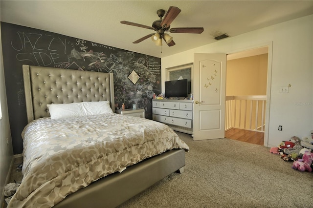 bedroom with ceiling fan and carpet flooring