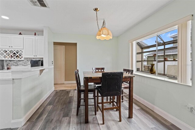 dining area featuring wood-type flooring