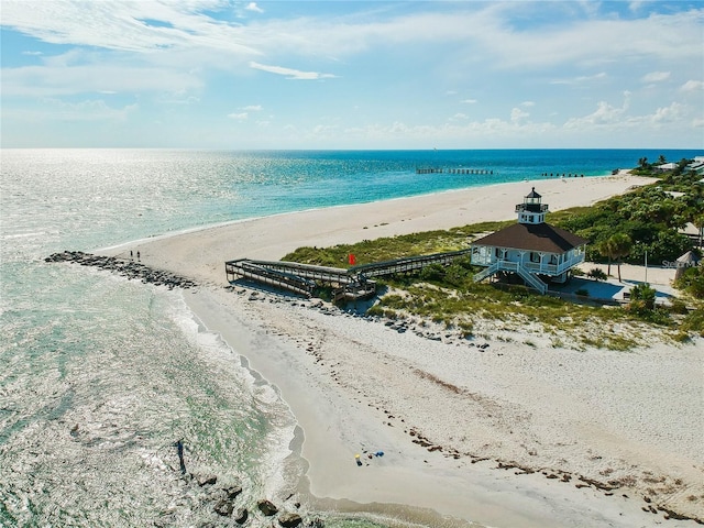 aerial view featuring a view of the beach and a water view