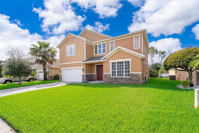 view of front of home featuring a front yard, central air condition unit, and a garage