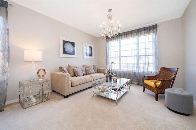 carpeted living room featuring an inviting chandelier