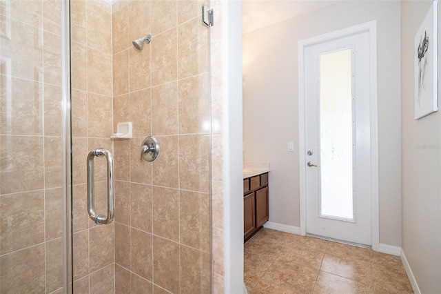 bathroom with vanity and a shower with shower door