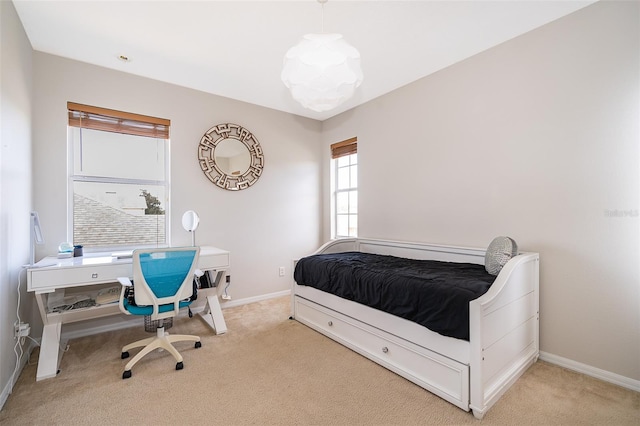 bedroom with light carpet