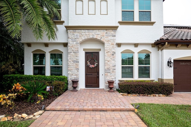 doorway to property featuring a garage