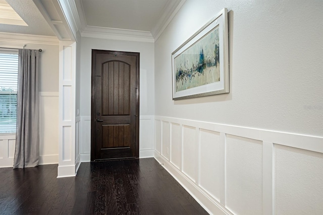 entryway with crown molding and dark hardwood / wood-style flooring