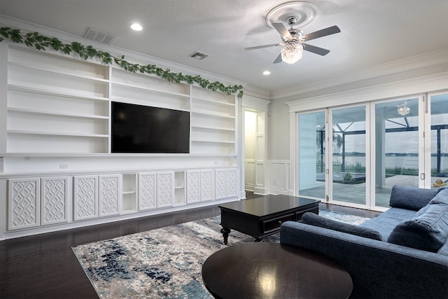 living room with ornamental molding, a textured ceiling, ceiling fan, and dark hardwood / wood-style flooring