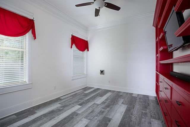 unfurnished room featuring ornamental molding, ceiling fan, and dark hardwood / wood-style floors