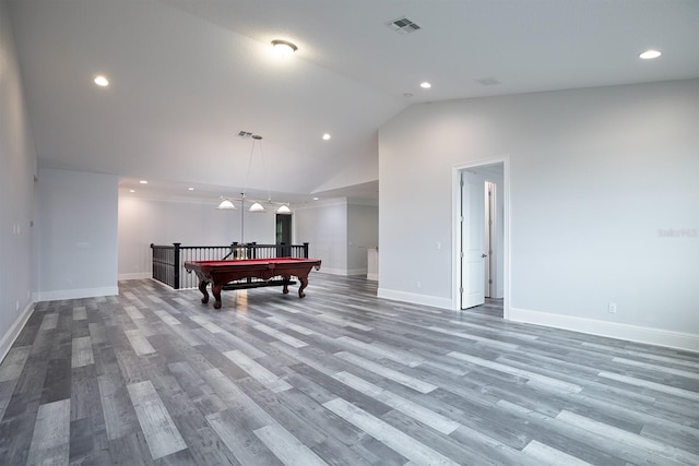 interior space featuring pendant lighting, pool table, high vaulted ceiling, and hardwood / wood-style floors