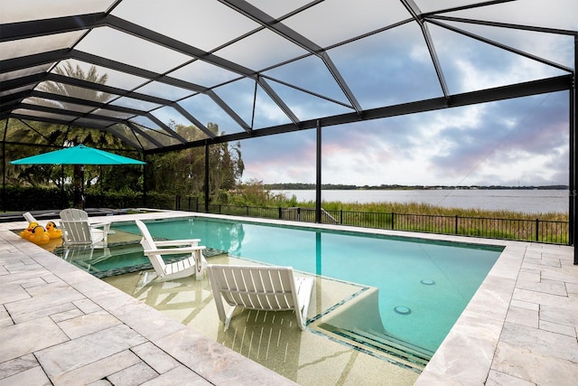 view of swimming pool with a patio, a water view, a jacuzzi, and glass enclosure