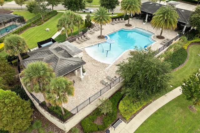 view of swimming pool with a yard and a patio area