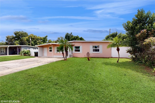 ranch-style home with a carport and a front yard