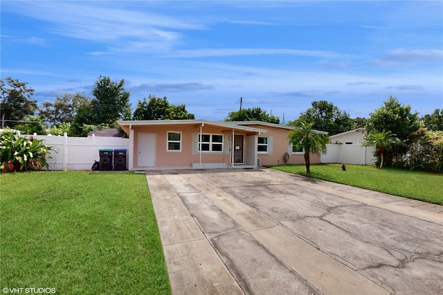 single story home with a front lawn