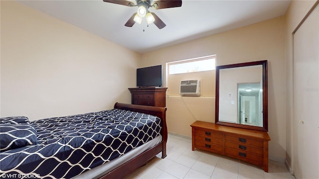 bedroom featuring ceiling fan and a wall unit AC