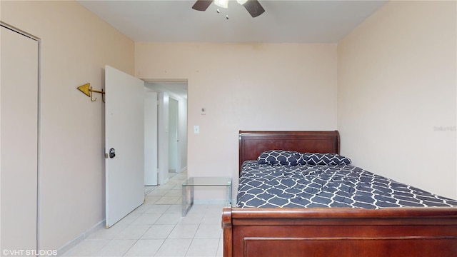 bedroom with ceiling fan and light tile patterned floors