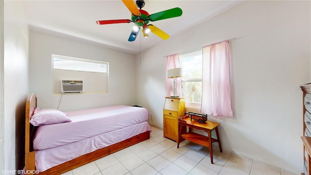 bedroom with cooling unit, ceiling fan, and light tile patterned flooring