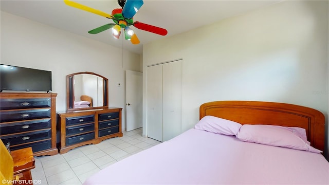 bedroom with a closet, ceiling fan, and light tile patterned floors