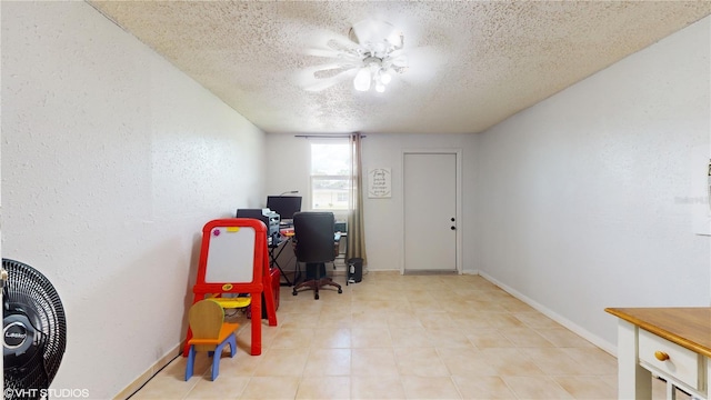 office with a textured ceiling and ceiling fan