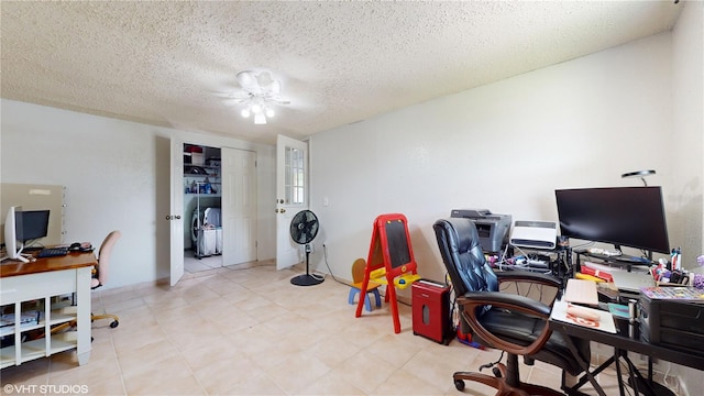 home office featuring a textured ceiling and ceiling fan