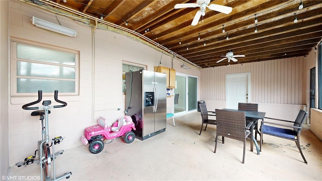 interior space with ceiling fan