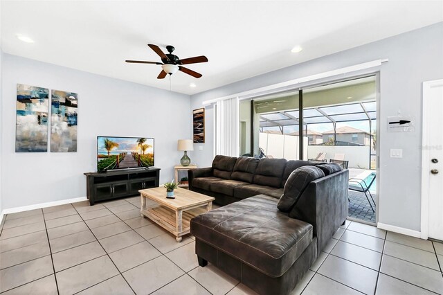 living room with light tile patterned flooring and ceiling fan