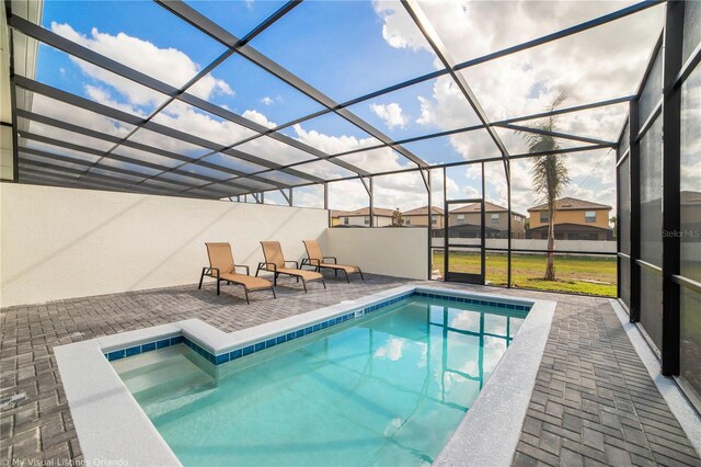 view of pool featuring a lanai and a patio