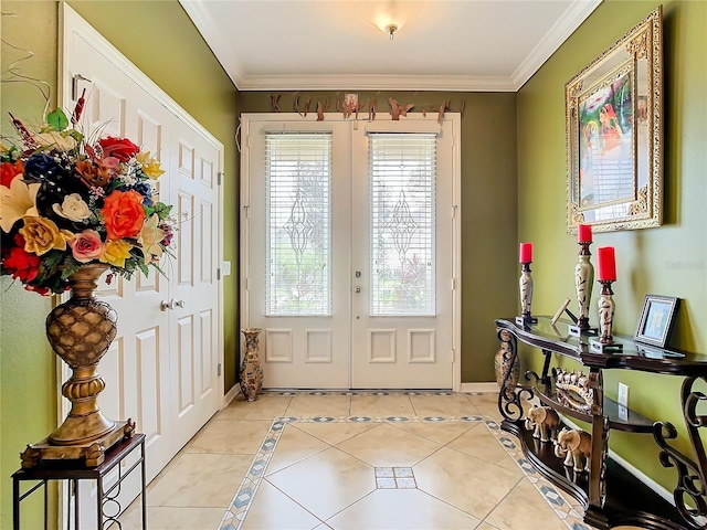 tiled entrance foyer featuring crown molding and french doors