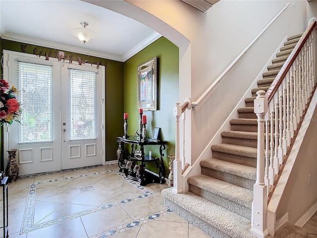 tiled entrance foyer with ornamental molding