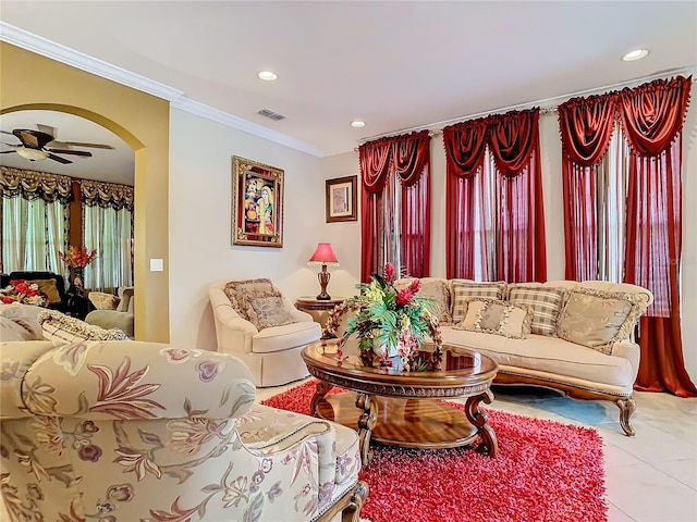 living room featuring tile patterned flooring, ornamental molding, and ceiling fan