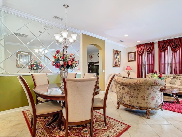 dining space featuring crown molding, light tile patterned floors, and a notable chandelier