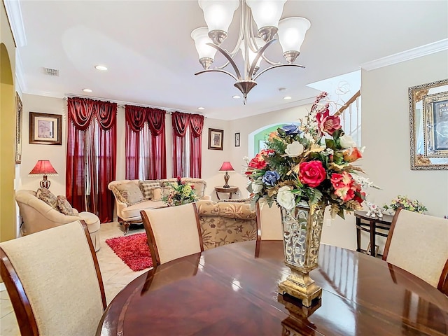 dining space featuring an inviting chandelier and crown molding