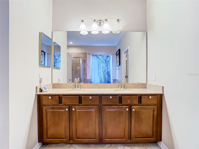 bathroom featuring vanity, curtained shower, and tile patterned floors