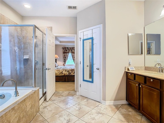 bathroom featuring vanity, separate shower and tub, and tile patterned floors