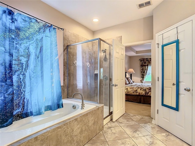 bathroom featuring shower with separate bathtub and tile patterned floors