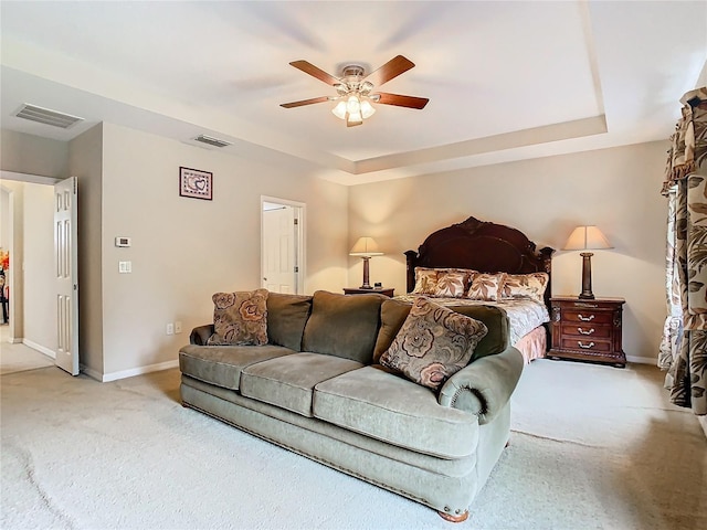 bedroom with ceiling fan and light carpet