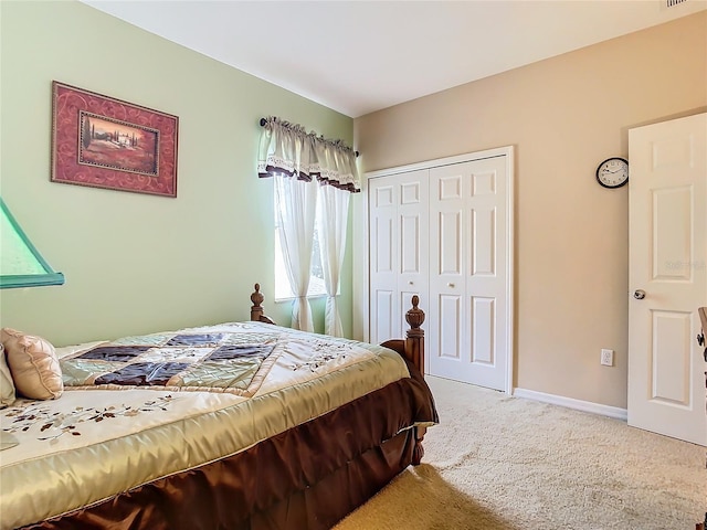 carpeted bedroom featuring a closet