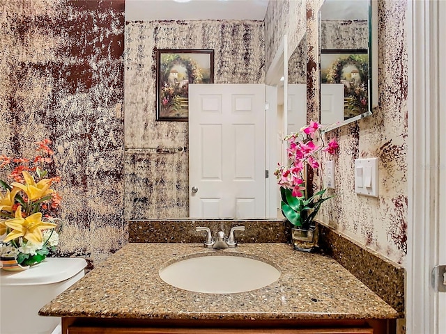 bathroom with vanity and toilet