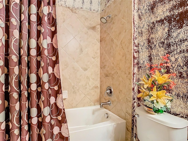 bathroom featuring shower / bath combo and toilet