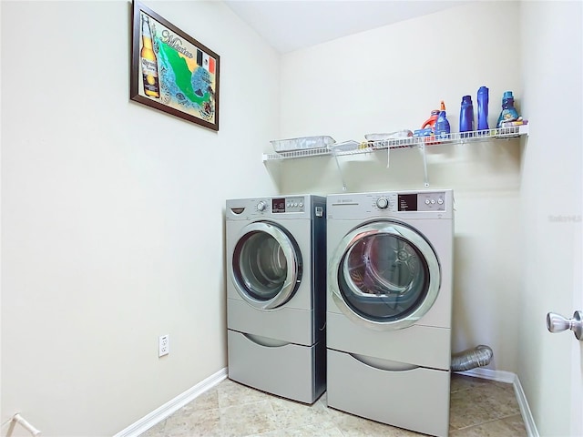 washroom featuring washer and dryer