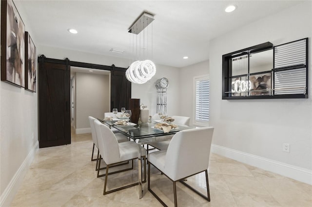 dining room with a barn door