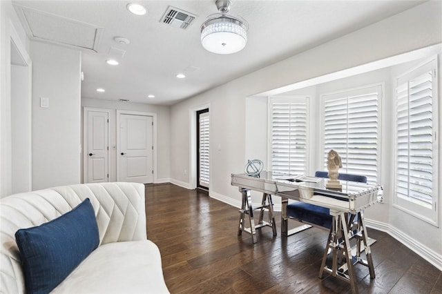 office space featuring a wealth of natural light and dark wood-type flooring