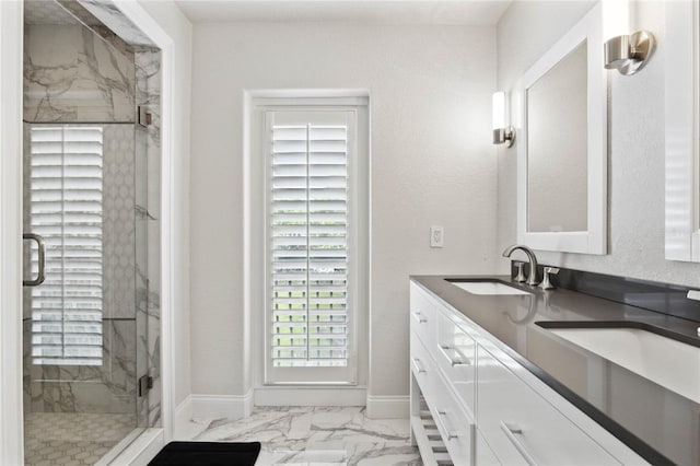 bathroom featuring vanity and an enclosed shower