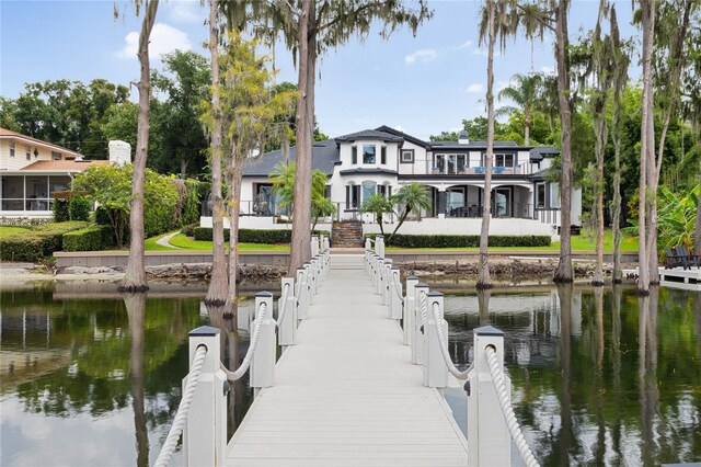 dock area with a water view