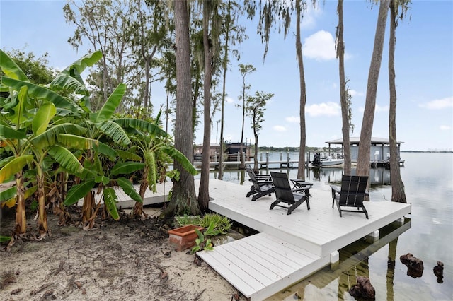 dock area with a water view and boat lift