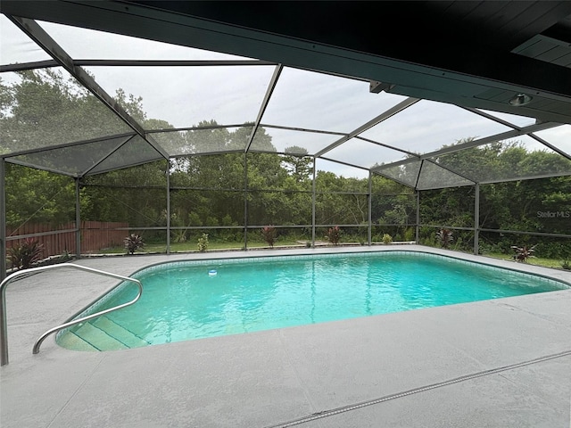 view of pool featuring a lanai and a patio