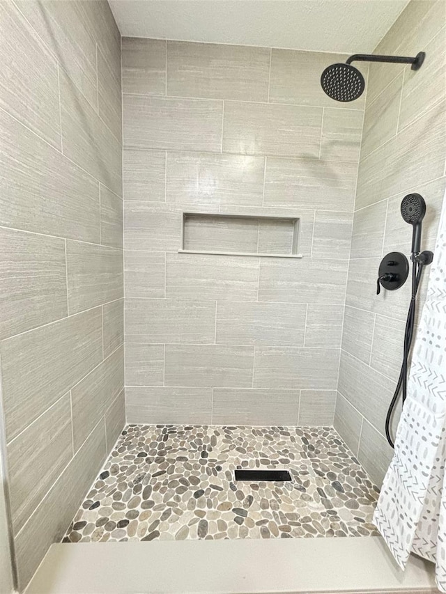 bathroom with a shower with shower curtain