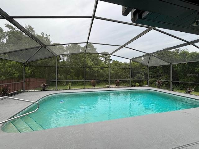 view of pool with a lanai and a patio area