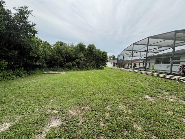 view of yard featuring a lanai