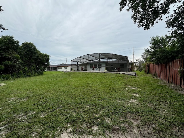 view of yard featuring glass enclosure