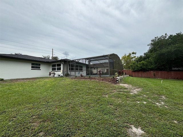 view of yard with a lanai