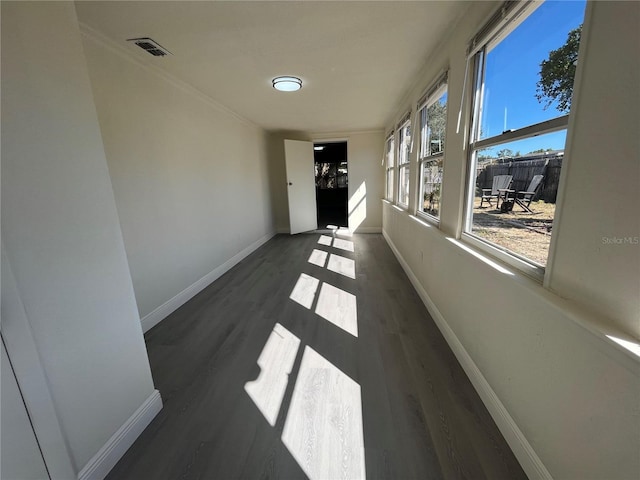 empty room featuring dark wood-type flooring